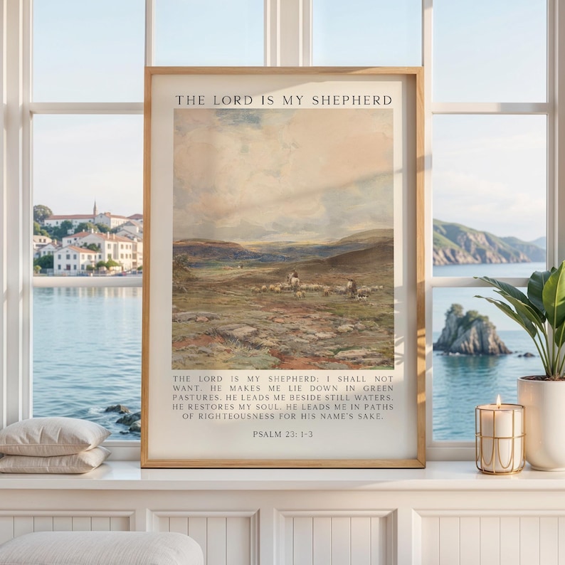 May include: Framed print featuring a pastoral landscape with a shepherd and flock. The artwork has a vintage aesthetic, with text at the top and bottom. The text reads "The Lord is my Shepherd" and Psalm 23:1-3.