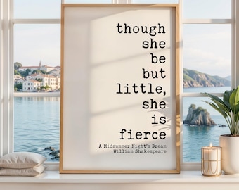 May include: A rectangular wall art print in a light wood frame featuring black typewriter-style text on a white background that reads: though she be but little, she is fierce. A Midsummer Night's Dream, William Shakespeare.