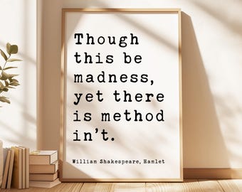 May include: A rectangular framed wall art print featuring the black typewriter-style text: Though this be madness, yet there is method in't. William Shakespeare, Hamlet. The print is set within a light-toned wooden frame with a clean white background.