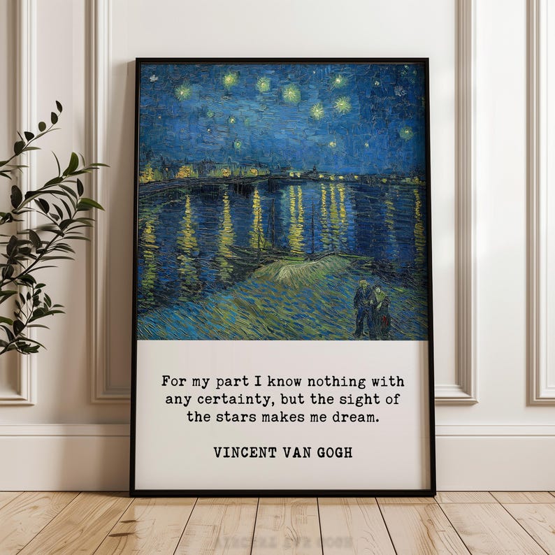 The image is a framed painting depicting a night sky with stars, and it is placed on a wooden floor against a white wall.