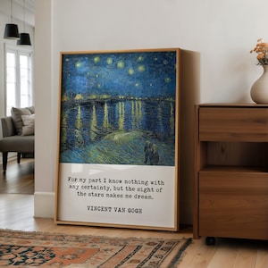 a large framed painting of a starry night landscape, with a quote by Vincent Van Gogh below it.