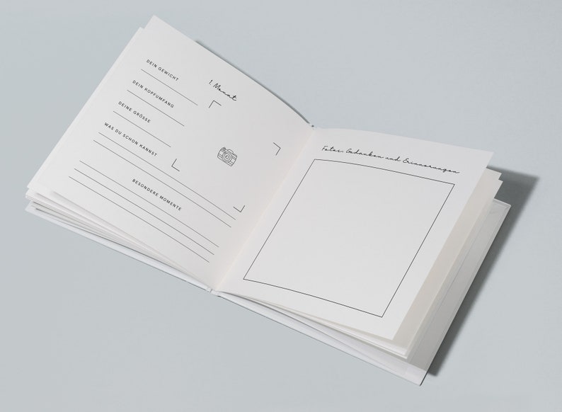 May include: Open white journal with lined pages and handwritten text in German. The journal includes prompts for recording weight, head circumference, height, and special moments. A photo icon is also present.