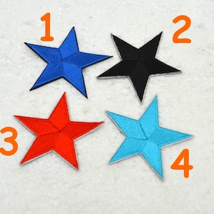 May include: Four embroidered star patches in different colours: blue, black, red, and turquoise. The stars are numbered 1 through 4.