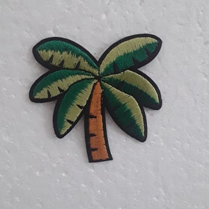May include: Embroidered green palm tree patch with a brown trunk. The patch is ideal for adding a tropical touch to clothing, bags, or other accessories.