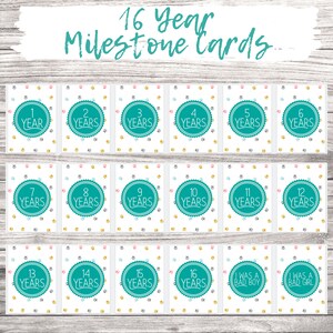 May include: A set of 16 milestone cards for a dog, featuring paw prints and a turquoise circle with the number of years on each card. The cards include numbers 1 through 16, as well as "I was a bad boy" and "I was a bad girl".