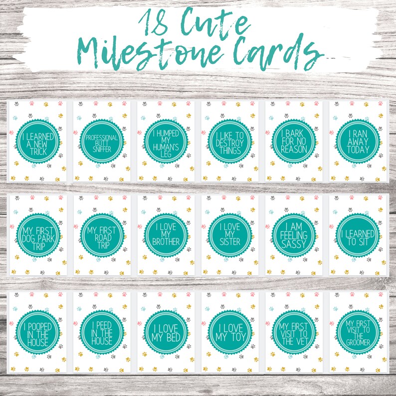 May include: 18 printable cards with cute dog milestones. Each card features a teal circle with white text on a white background with paw prints in pink, gray, and gold.