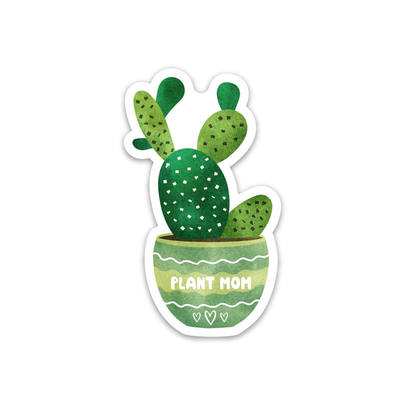 May include: A green cactus plant with a green pot that says "Plant Mom" in white text. The pot has a white wavy line design and three white hearts at the bottom.