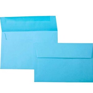 May include: Two light blue envelopes, one slightly larger than the other, are stacked on top of each other. The envelopes are made of a smooth, textured paper.