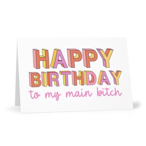 May include: A white card with the text "HAPPY BIRTHDAY to my main bitch" in colorful, 3D-style letters.
