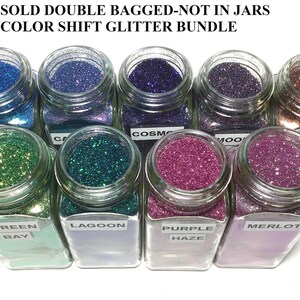 K&ouml;nnte beinhalten: Zehn Gl&auml;ser mit Farbwechselflitter, beschriftet mit Namen wie Green Bay, Lagoon, Purple Haze und Merlot. Der Glitter wird in doppelt verpackten B&uuml;ndeln verkauft, nicht in Gl&auml;sern.