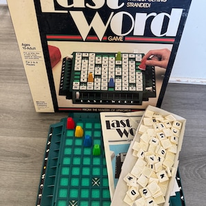 May include: A vintage "Last Word" board game. The box is black with white lettering and features the game's name. The game includes a green game board, letter tiles, and colored game pieces. The game is for 2 to 4 players.
