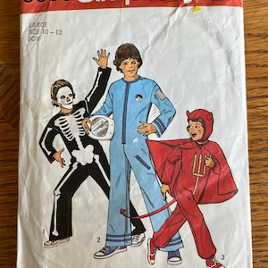 May include: Simplicity sewing pattern number 6696 for a boy's Halloween costume. The pattern includes three costumes: a skeleton, an astronaut, and a devil. The pattern is for sizes 10-12.