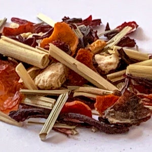 May include: A mix of dried fruit, herbs, and flowers for making tea. The mix includes orange peel, hibiscus, lemongrass, and other ingredients.
