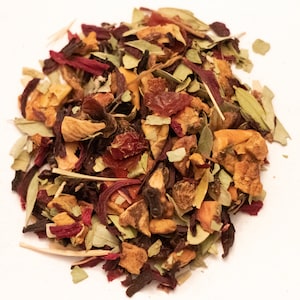 May include: A mix of dried fruit, herbs, and flowers for making tea. The mix includes orange, apple, hibiscus, and other ingredients.