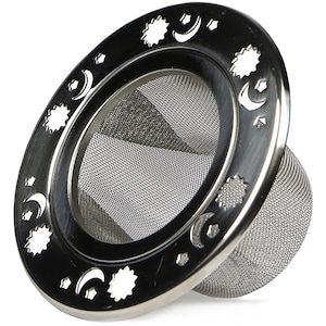 May include: A stainless steel tea infuser with a celestial design. The infuser features a mesh basket for tea leaves and a decorative rim with cut-out stars, moons, and small star shapes. The infuser is designed for steeping loose leaf tea.
