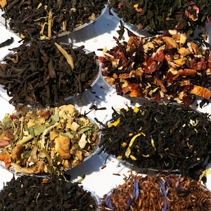 May include: Assortment of loose leaf tea blends in clear spoons. The blends include black tea, green tea, herbal tea, and fruit tea.