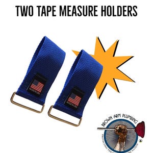 May include: Two blue tape measure holders with metal buckles. Each holder has a label with the American flag and the text "MADE IN USA". The image also includes the text "TWO TAPE MEASURE HOLDERS" and a logo for Brown Arm Plumbing.