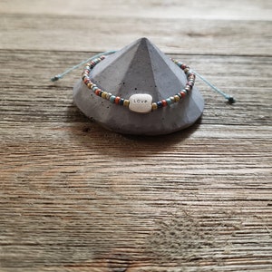 Love Charm and Seed Bead Bracelet | Adjustable and Waterproof | Light Blue Polyester Waxed Cord | Stackable