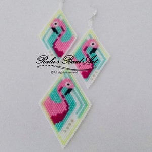 May include: A pair of pink flamingo earrings with white, blue, and green beadwork. The earrings are diamond-shaped and have silver hooks. The text "Ralu's Bead Art" and "© All rights reserved" is printed on the white background.