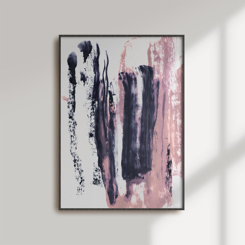 May include: Abstract painting in a black frame with pink and purple brushstrokes on a white background.