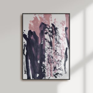 May include: Abstract painting with pink and purple brushstrokes on a white background. The painting is framed in a black frame.