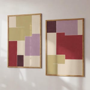May include: Two framed abstract art prints with geometric shapes in shades of beige, purple, red, and brown.