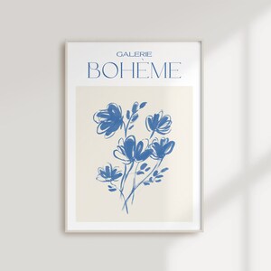 May include: A blue and white abstract floral print with the text "GALERIE BOHEME" in a white frame.
