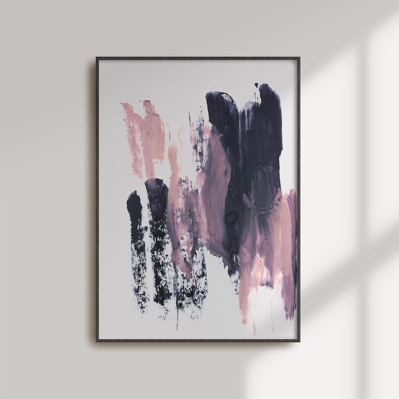 May include: Abstract painting with pink and purple brushstrokes on a white background. The painting is framed in a black frame.