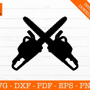May include: Black silhouette of two crossed chainsaws. The image includes the text "SVG Design Studios" and "INSTANT DOWNLOAD". Below the chainsaws, the text reads "SVG - DXF - PDF - EPS - PNG".