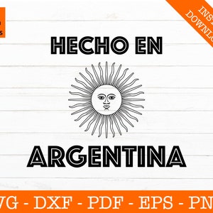 May include: Black and white graphic design with the text "HECHO EN ARGENTINA". The graphic features a stylized sun with a face.