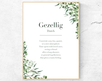 May include: A printable wall art print with a green leafy design and the word "Gezellig" in a dark green font. The word "Gezellig" is defined as "Convivial, cozy, fun, quaint, or a nice atmosphere. Time spent with loved ones, seeing a friend after a long absence, or general togetherness that gives a warm feeling." The text is in a white font on a white background.