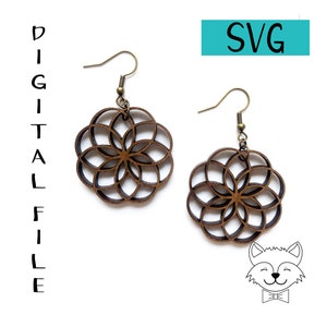 May include: A pair of wooden earrings with a geometric flower design. The earrings are brown and have a gold-toned hook.