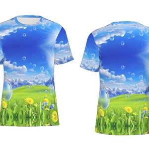 May include: A blue and green t-shirt with a graphic print of a sunny sky with clouds and bubbles over a green field with yellow flowers and mountains in the background.