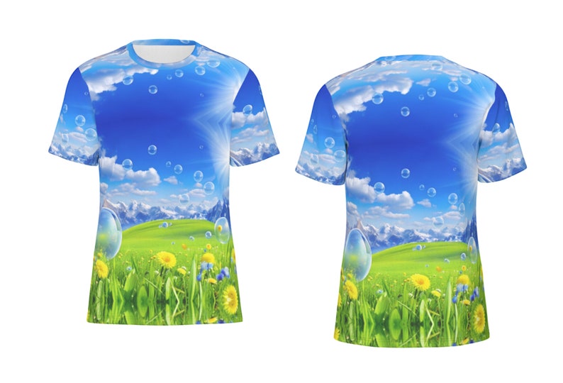 May include: A blue and green t-shirt with a graphic print of a sunny sky with clouds and bubbles over a green field with yellow flowers and mountains in the background.