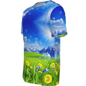 May include: A blue and green t-shirt with a graphic print of a sunny mountain landscape with clouds and bubbles.