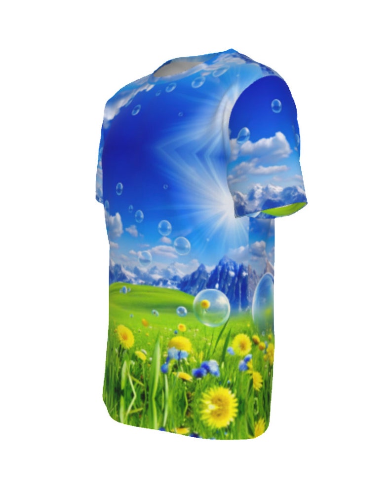 May include: A blue and green t-shirt with a graphic print of a sunny mountain landscape with clouds and bubbles.