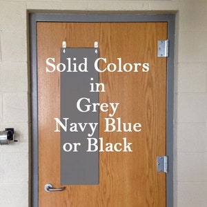 May include: A wooden door with a sign that says "Solid Colors in Grey, Navy Blue or Black".