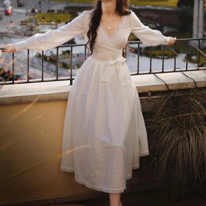 Romantic white midi dress made of embroidered cotton, cottagecore wedding, modest style wrap dress, dress with bow, vintage style lace dress