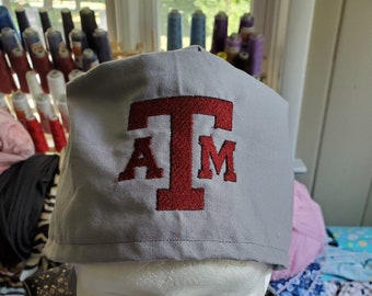 Aggie Tie Back Scrub Hat on various colors of fabric