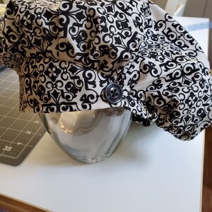 Geometric bouffant w buttons and toggle