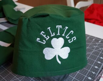 Celtics scrub hat on green fabric and more