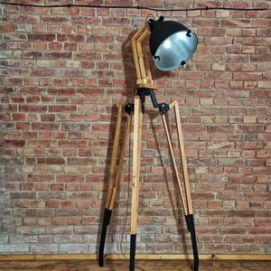 Large industrial floor lamp - tripod. A tall wooden lamp with a large black shade. A large tripod lamp on original legs