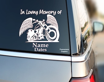 May include: White vinyl decal of a motorcycle with angel wings. The decal says "In Loving Memory of" and has space for a name and dates. The decal also says "Forevermore Graphics".