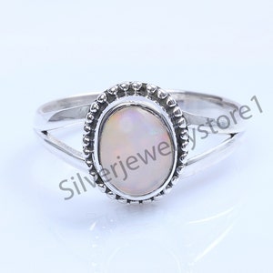 Ethiopian Opal Sterling Silver Ring: Oval Gemstone Statement Ring (7X9 MM)