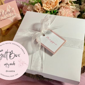 white 6x6 card gift box tied with white organza ribbon and personalised name tag