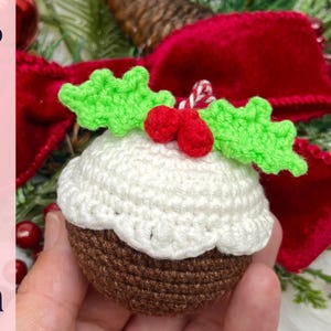 May include: A crocheted Christmas pudding ornament with a brown base, white top, and green holly leaves with red berries. The word "Pattern" is vertically displayed on the left side of the image.