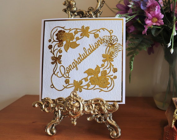 Unique Handmade Congratulations Card with fancy embossed brocade background, 3D Butterfly, Gold Die Cut Floral frame and Sentiment.