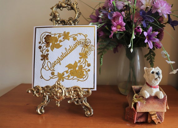 Unique Handmade Congratulations Card with fancy embossed brocade background, 3D Butterfly, Gold Die Cut Floral frame and Sentiment.