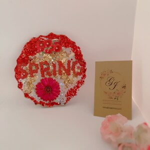 COASTER  with Spring motives  in red and blue background . Measure: 5&quot; diameter ( 1 set of 4 coasters)