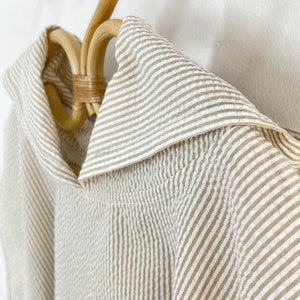 Poncho for children in beige striped cotton image 2